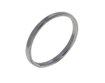 May include: A silver-colored ring with a flat band. The ring is circular and appears to be made of metal. The ring is set against a white background.