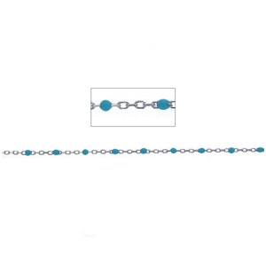 May include: A silver chain with turquoise blue beads. The chain is made of small, linked circles.