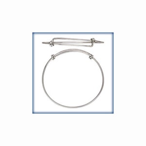 May include: Two silver-toned metal wire bracelets with an expandable design. Each bracelet features a circular band with two sliding knots that allow for size adjustment. The metal has a smooth, polished finish and a thin, lightweight construction.