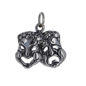 May include: Silver charm featuring a pair of theatrical masks, one smiling and one frowning, representing comedy and tragedy.