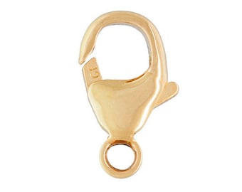 May include: Gold-tone lobster clasp with a spring ring closure. The clasp is marked "GF" for gold filled.