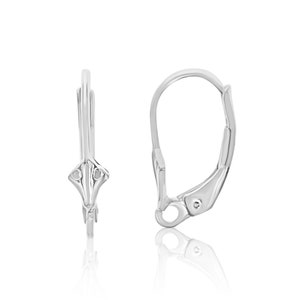 May include: A pair of silver earring hooks with a decorative design at the top.