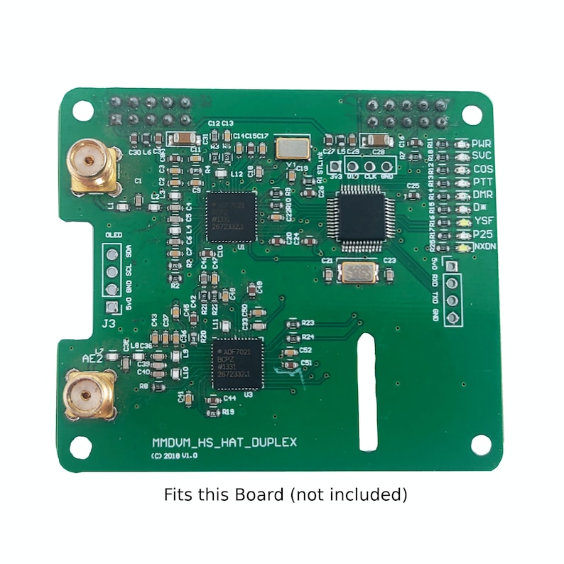 May include: A green circuit board with a variety of components, including a chip, resistors, and capacitors. The board is labeled "MMDVM_HS_HAT_DUPLEX (C) 2018 V1.0".