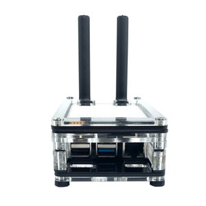 May include: A clear plastic case with a black circuit board inside. The case has two black antennas sticking out of the top. There are three USB ports on the front of the case.