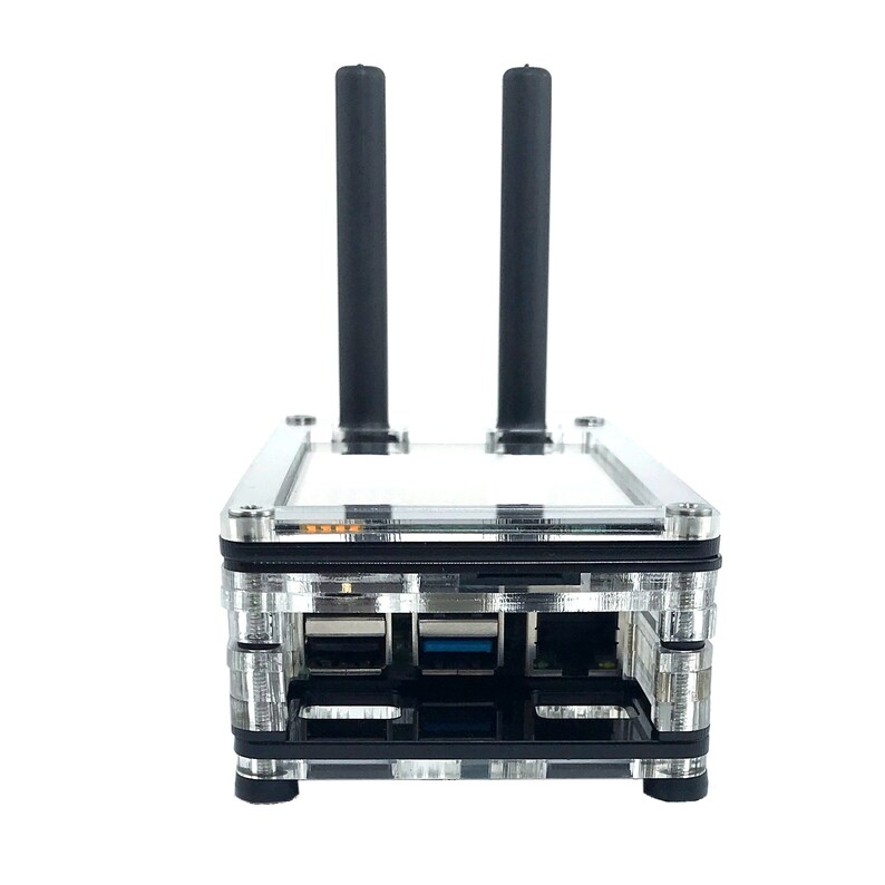 May include: A clear plastic case with a black circuit board inside. The case has two black antennas sticking out of the top. There are three USB ports on the front of the case.