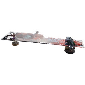 May include: A clear acrylic gaming mat with a red and white bloody design. The mat features a large eye graphic and a small skull graphic. Two miniature figures are placed on the mat.