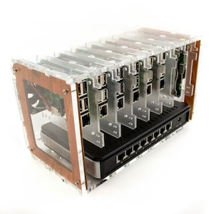 May include: A clear acrylic case with a wooden trim holds multiple Raspberry Pi computers. The case has a black network switch with multiple ports.