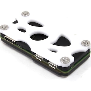 May include: White plastic case with a cutout design and four silver screws. The case is designed to hold a small electronic device.