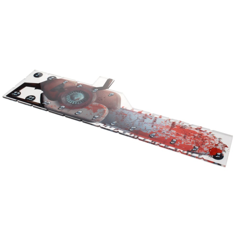 May include: A clear acrylic game board with a bloody chainsaw graphic. The board has numbered spaces for game pieces.