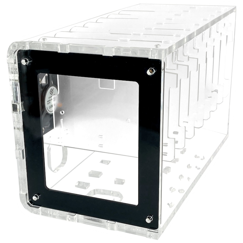 May include: A clear acrylic case with a black frame and a fan visible inside. The case has multiple slots for holding items.