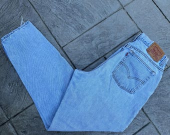 Size 33 Women's Levi's 550 Jeans / Light Denim / Distressed / Relaxed Fit Tapered Leg  / Made in USA / Levi's 550 Denim Jeans /  Waist 33