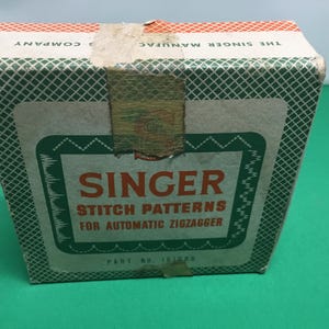 1940s Singer zig zag attachment design cams still in orinal box part nos 161008 .