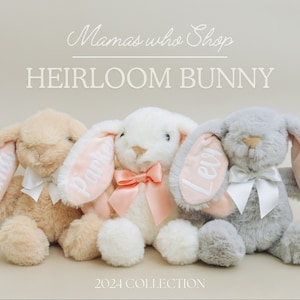 May include: Three plush bunny toys with pink ears and white bows. The ears are personalized with the names Emma, Parker, and Levy. The bunnies are beige, white, and gray. The text "Mamas who Shop Heirloom Bunny 2024 Collection" is displayed above the bunnies.