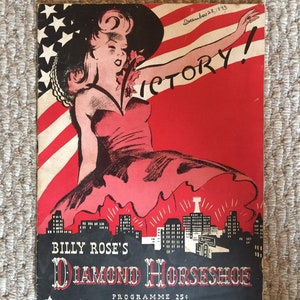 May include: A red, white, and blue program for Billy Rose's Diamond Horseshoe, featuring a woman in a red dress and a hat, with the word "Victory!" written in large letters. The program is dated December 25, 1943.