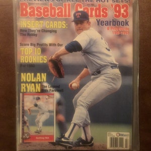 May include: A magazine cover for Baseball Cards '93 Yearbook & Price Guide 1948-1993. The cover features a baseball player wearing a white and blue uniform with a red 'T' on the cap, pitching a baseball. The text 'Nolan Ryan The Legend Bids Farewell' is printed on the cover.