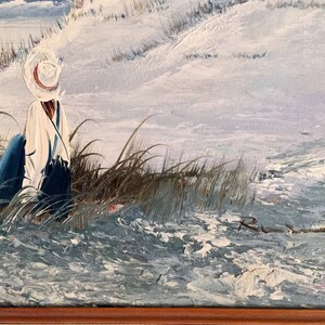 May include: A painting of a person wearing a white hat and blue clothing standing in tall grass by a body of water. The painting is signed "R.W." in the bottom right corner.