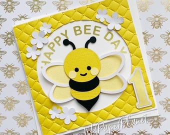 Happy Bee Day birthday card. Bumblebee, honey bee first birthday. Greeting card.