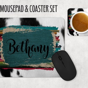 May include: A cowhide mousepad and coaster set with a teal and multi-colored design. The mousepad features the name "Bethany" in black script.