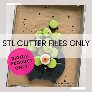 May include: STL cutter files for a monster cookie cutter design. The design features a black monster with green eyes and a green body. The image shows the cookies cut out and decorated with green icing and black and white sprinkles. The image also includes the text "STL CUTTER FILES ONLY" and "DIGITAL PRODUCT ONLY".