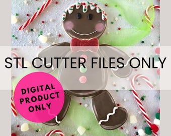 May include: A gingerbread man cookie cutter STL file. The image shows a gingerbread man cookie with brown icing, red and white candy, and green and pink sprinkles. The text "STL CUTTER FILES ONLY" and "DIGITAL PRODUCT ONLY" is visible in the image.