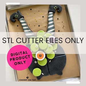 May include: A digital download of STL cutter files for a witch's legs and a monster cookie cutter. The image shows the cookie cutters on a baking sheet with a pink circle that says "Digital Product Only".