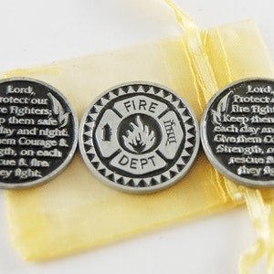 May include: Three silver-toned tokens with a prayer for firefighters. The centre token features a fire department logo with the words "FIRE DEPT" and a flame. The other two tokens have a prayer for firefighters that reads "Lord, Protect our Fire Fighters; Keep them safe each day and night. Give them Courage & Strength, on each rescue & fire they fight."