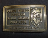 Vintage Belt Buckle Peace Shield Program Saudi Arabia - 1984 to 1991