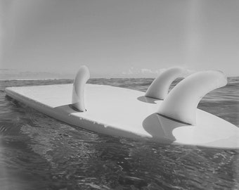 Surfboard Floating on the Ocean Photo Print. Black and White Surf Picture