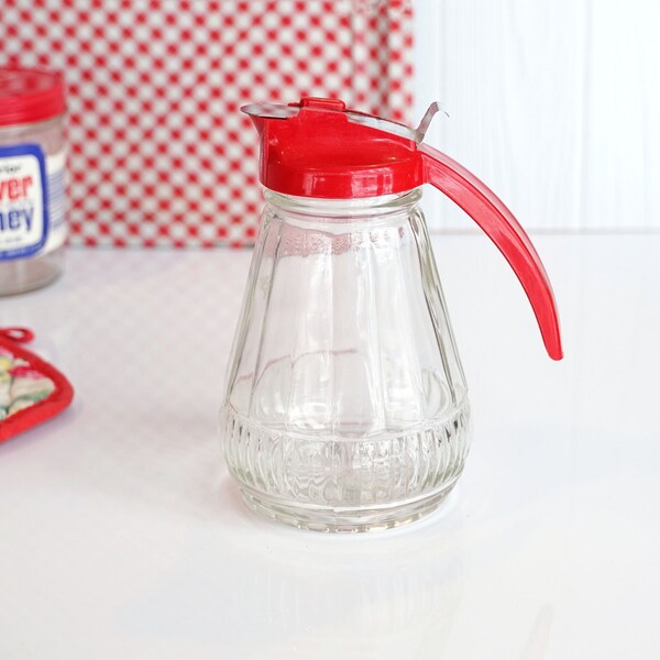 Vintage 1950s Syrup Dispenser, Mid Century, Heavy Pattern Glass, Tapered Body, Embossed Star Base, Red Plastic Top & Handle Metal Slide