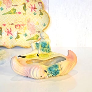 May include: A handmade wooden sign with the text "Welcome" in a playful font. The sign features a distressed white background and a dark stained wooden frame. Dimensions are approximately 12 inches wide and 6 inches high.