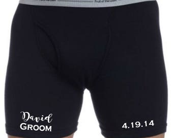 May include: Black boxer briefs with white text that says "David GROOM" on the left leg and "4.19.14" on the right leg.