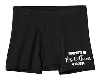 May include: Black boxer briefs with the text "PROPERTY OF Mrs. Williams 4.19.2014" printed in white. The underwear has a comfortable fit and a classic design.