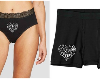 May include: Black underwear with a white heart graphic that says "two hearts one love".