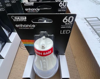 Twelve Feit Electric 60 watt Light Bulbs. New. unopened.