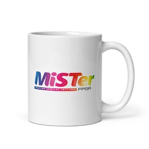 May include: White ceramic coffee mug with a colorful logo that says "MiSTer FPGA".