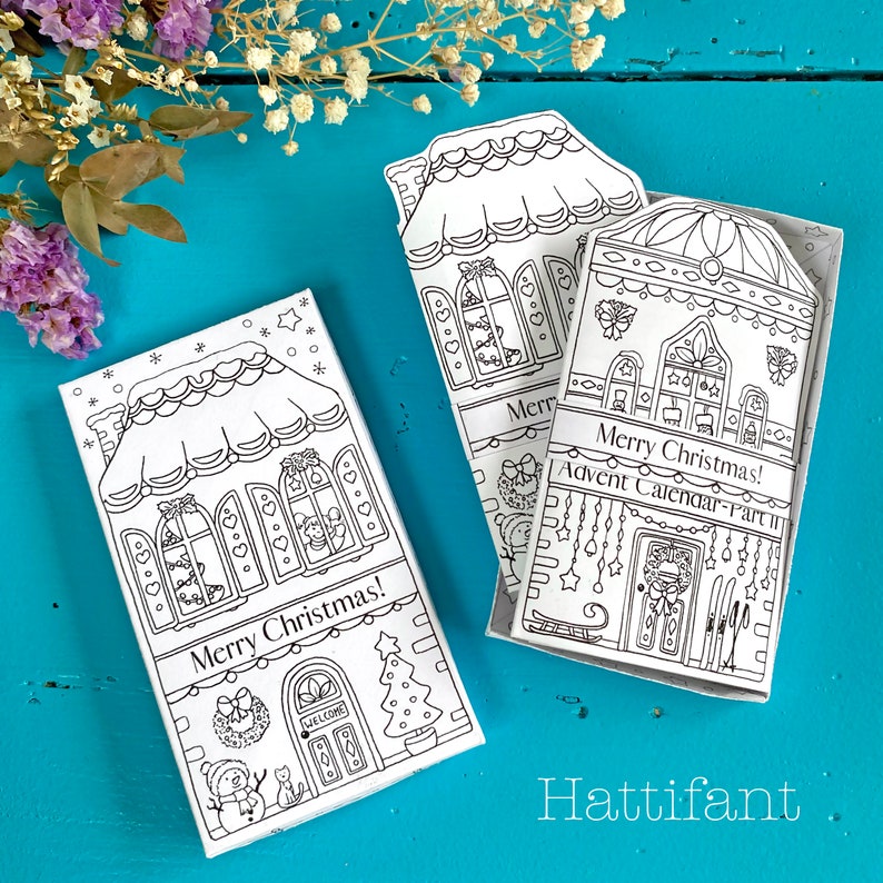 May include: Black and white printable Christmas advent calendar with a gingerbread house design. The calendar has the text "Merry Christmas! Advent Calendar - Part II" on the front.
