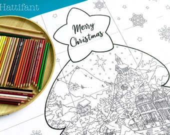 May include: A black and white Christmas-themed coloring page with a tree shape, featuring a detailed winter village scene and the words "Merry Christmas." A wooden tray holds a variety of colored pencils.