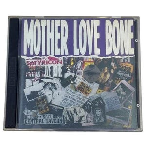 May include: A CD case featuring the album "Mother Love Bone" with a purple and white design. The album title is prominently displayed. The case includes various images and text, including "Satyricon" and "Central Tavern."