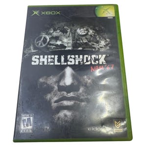 May include: Xbox video game case for Shellshock: Nam '67. The cover features a soldier's face, the game title, and the Xbox logo. The case has a green border and the ESRB rating.