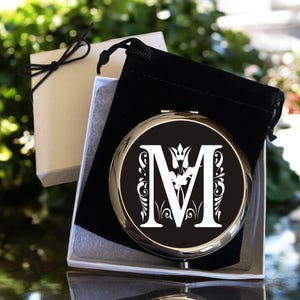 May include: A set of three ceramic mugs with a speckled, matte finish. The mugs are in shades of cream, light gray, and dark gray. Each mug has a simple, minimalist design, perfect for coffee or tea.