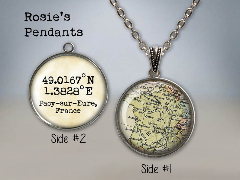 May include: A silver necklace with a round pendant featuring a vintage map of France. The pendant also includes the coordinates 49.0167&deg;N 1.3828&deg;E and the text "Pacy-sur-Eure, France".