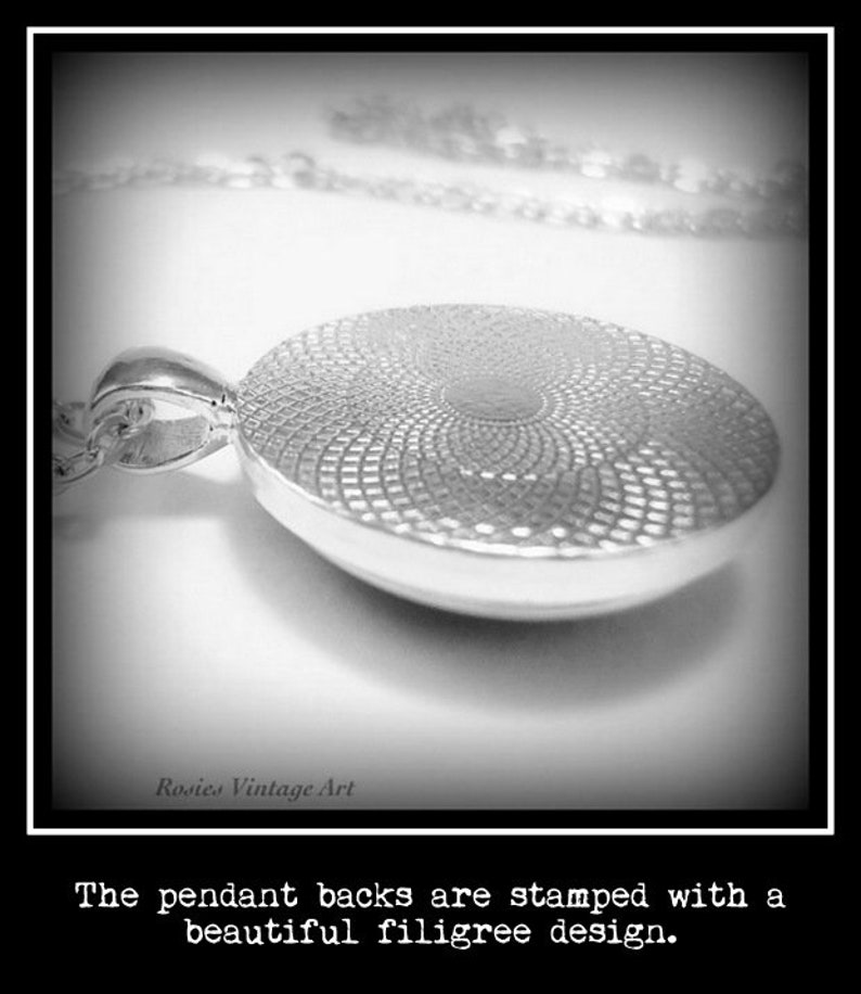 May include: Close-up of the back of a silver pendant with a filigree design. The pendant is attached to a silver chain.