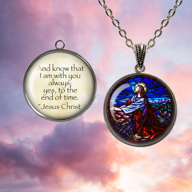 May include: A silver necklace with a round pendant featuring a stained glass image of Jesus Christ. The pendant has a second side with a quote from Jesus Christ: "And know that I am with you always; yes, to the end of time." - Jesus Christ