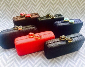 Elegant Grasscloth Clutches with Choice of Gold-Gilded Red Coral, Turquoise, or Smoky Quartz Clasps.