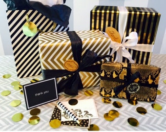 Custom Gift Wrapping & Cards in Choice of Signature Gold, Black, and White Packaging.
