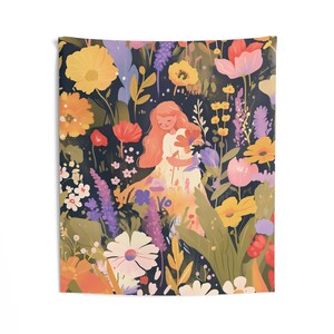 May include: A tapestry featuring a whimsical illustration of a person standing in a field of colorful flowers. The flowers are in shades of pink, yellow, orange, and purple. The person is wearing a white dress and has long, flowing hair.