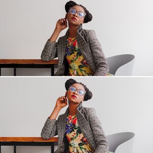 Puede incluir: Una mujer con un blazer de cuadros blanco y negro sobre un vestido floral. Lleva gafas de montura azul y tiene el pelo recogido en un mo&ntilde;o.