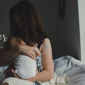 May include: A woman holds a baby in her arms. The woman is wearing a white dress with a floral pattern. The baby is wearing a white onesie. The image is titled "Closer preset for Adobe Camera Raw".