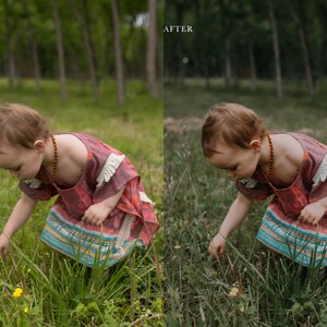 May include: A young child wearing a pink and blue patterned dress with white fringe is kneeling in a grassy field, looking down at the ground. The child is wearing a beaded necklace and has red hair.