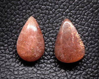 Paar natuurlijke gouden zonnesteen edelstenen: cabochons met peer, AAA-kwaliteit